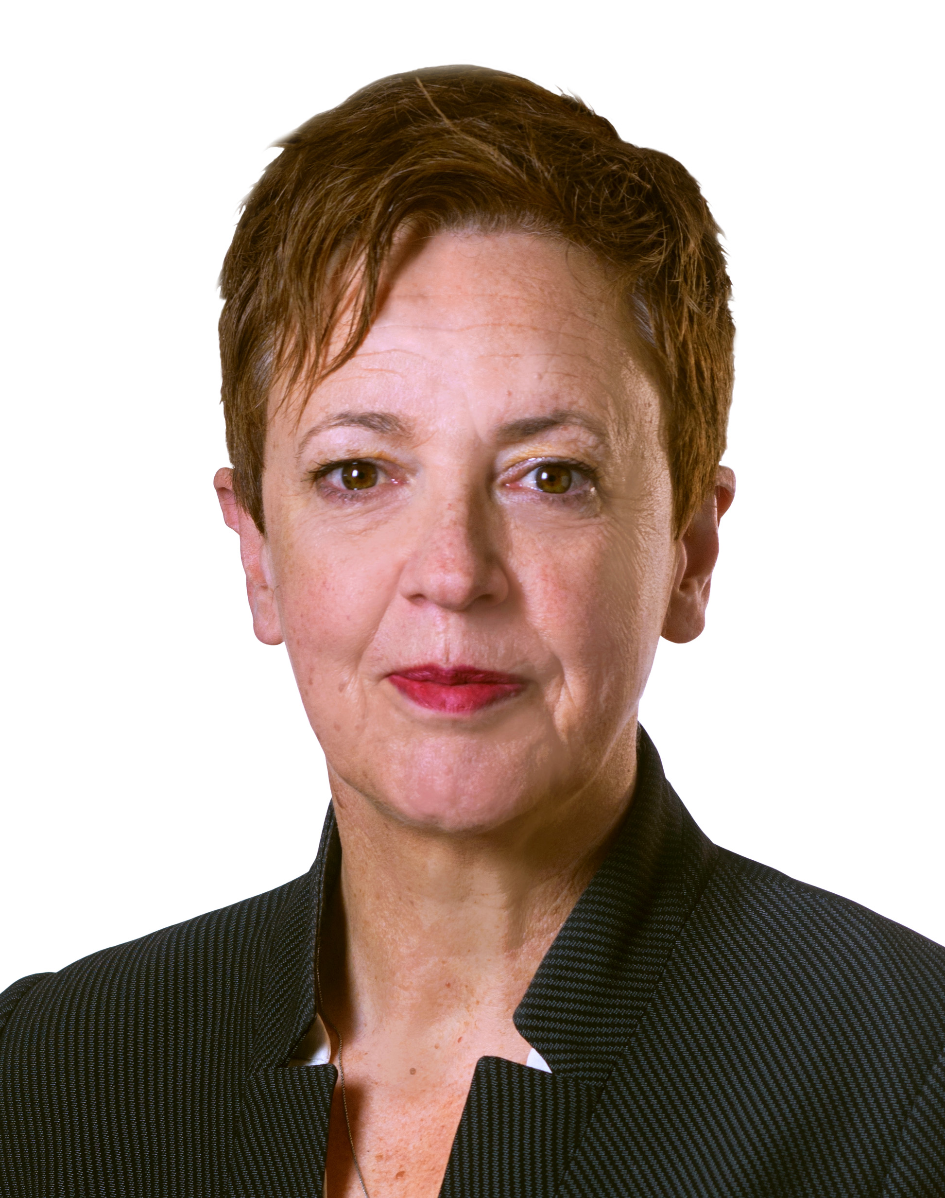 Jenny Atta headshot - women with short reddish-brown hair, wearing red lipstick and a black business jacket.